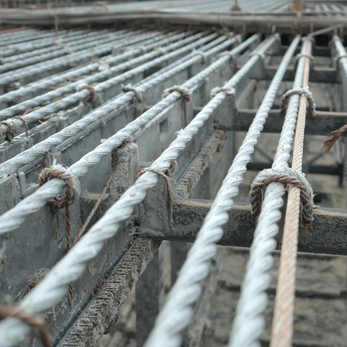 Steel strands tensioned in formwork before concrete pouring