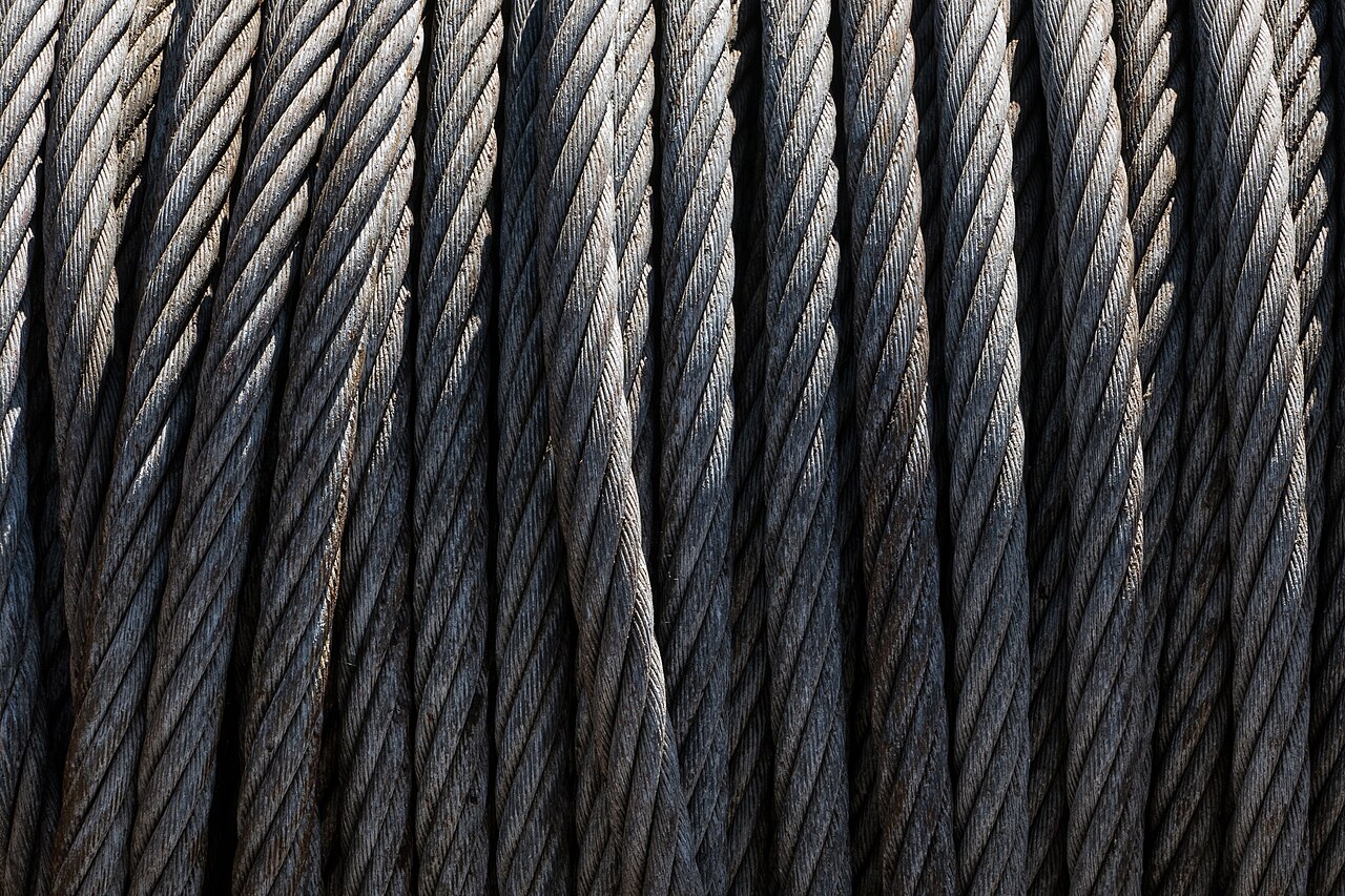 Close-up of steel wire rope wraps spooled on a drum