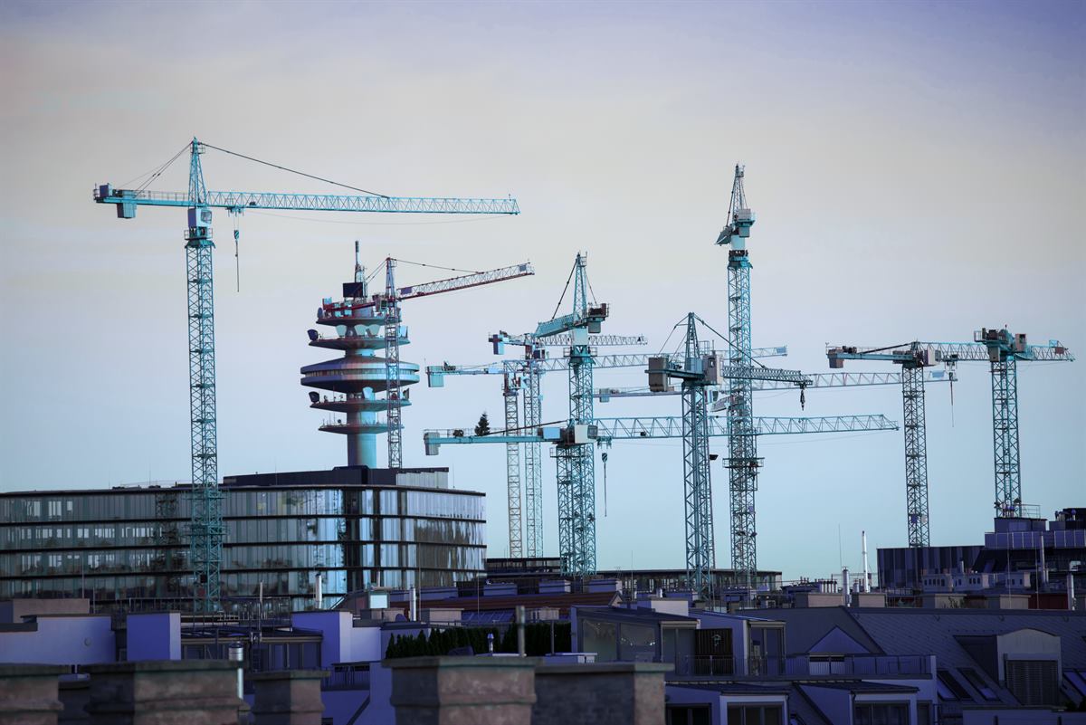 Tower cranes above an urban construction site